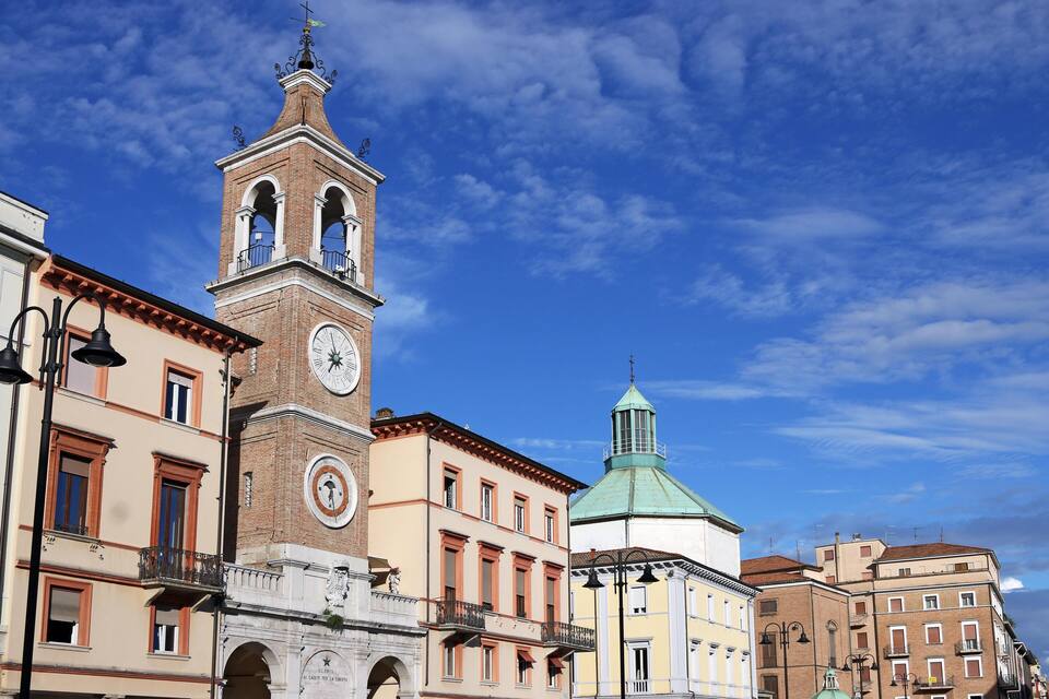 A historic building with a clock tower and a dome.