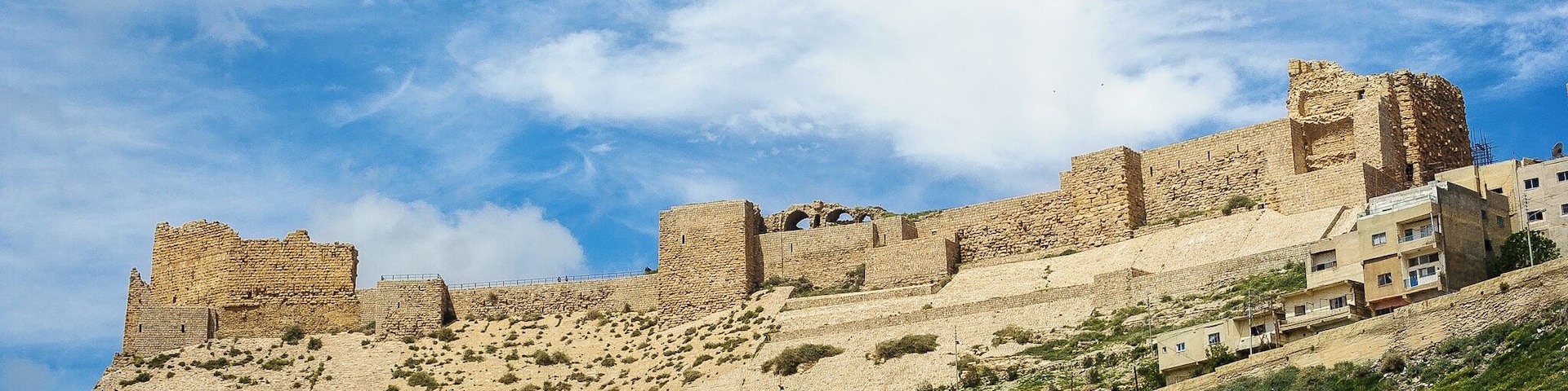 Kerak Castle is one of the largest crusader castles in the Levant. The castle was built in the 1140s to replace the weaker castle of Montreal (aka Shoubak Castle) to the south. Because of its position east of the Dead Sea, Kerak Castle maintained control of trade routes from Damascus to Egypt and Mecca. Saladin captured Kerak Castle in 1187, where it continued to play a key role during the Ayyubid, Mamluk, and Ottomon Empires until 1917.