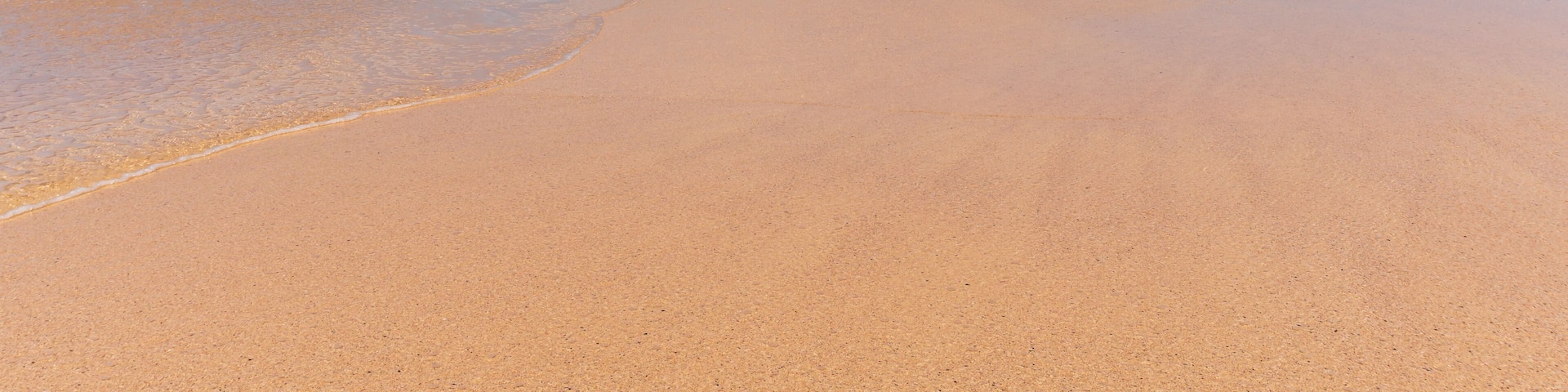 Amazing beach with untouched sand and turquoise waters on a sunny summer day landscape. La Conchas beach (Playa de las Conchas) on La Graciosa Island, Canary, Spain.