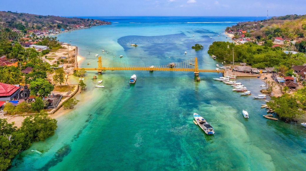 Aerial view of Yellow bridge between the islands of Nusa Ceningan and Nusa Lembongan, Bali in Indonesia