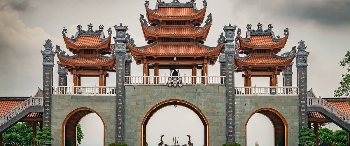 A traditional Chinese gate with ornate architecture, including multiple tiers and decorative elements.