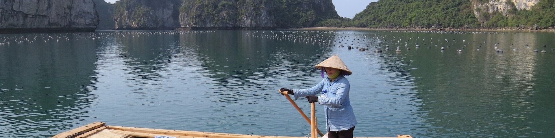 Vietnamese boat woman in Vung Vieng and the Pearl Farm, Bai Tu Long Bay, Vietnam.
