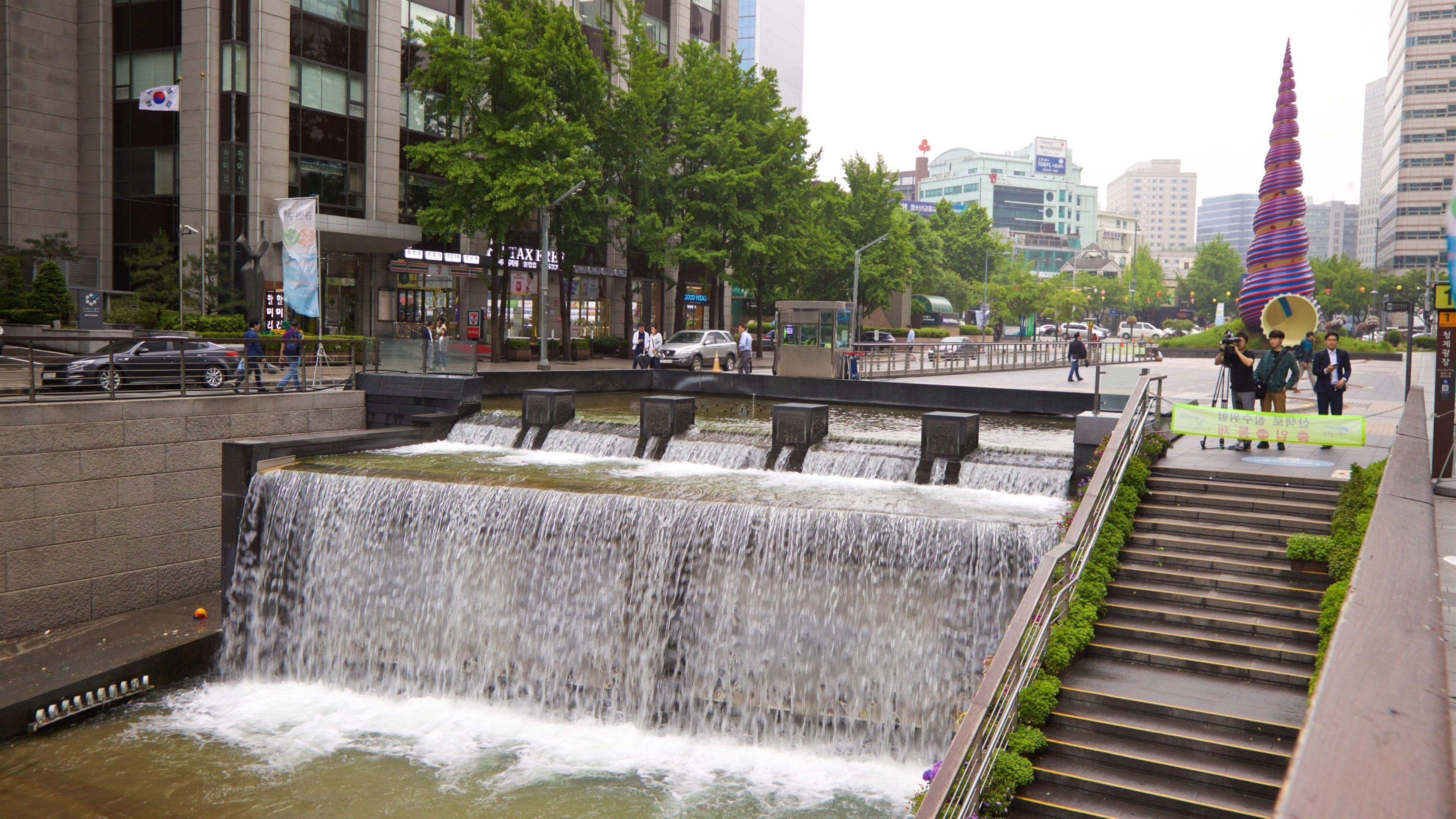 Cheonggye Plaza which includes a city and a river or creek