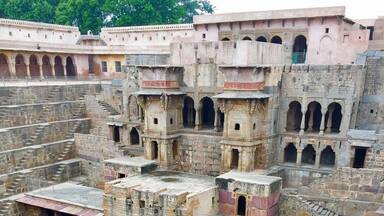 A historical fort with multiple levels and arched windows.