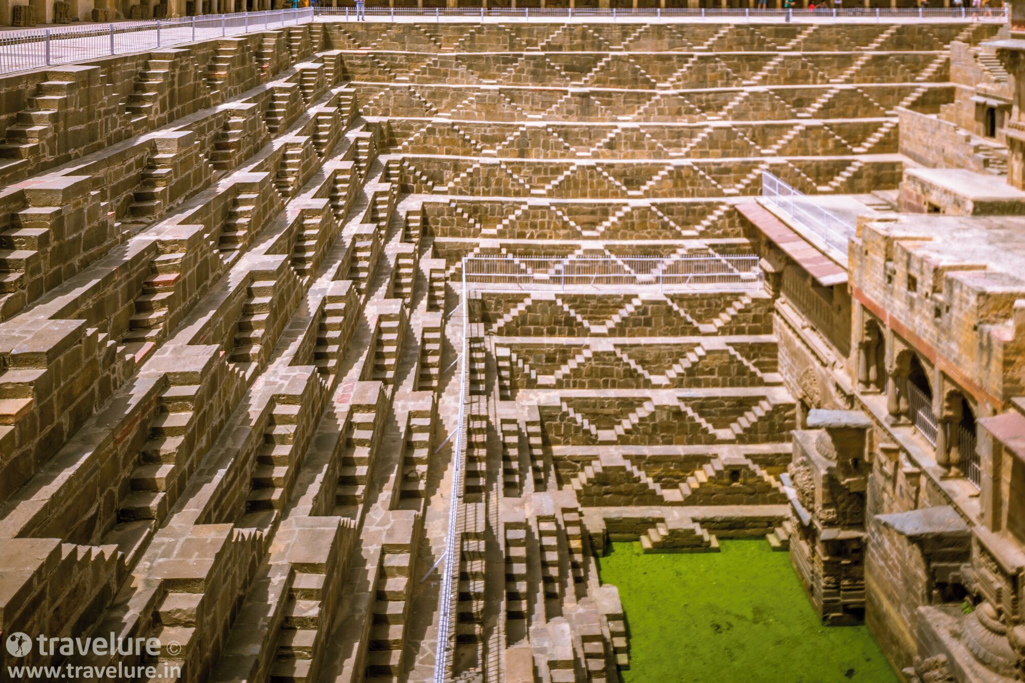 The geometrical precision of this step well can be best appreciated when the sunlight illuminates the entire step well. Do not miss the light and shade arrow-formation of this 9th-century CE marvel! 
#StunningStructures #travelure #ChandBaori #Abhaneri #Rajasthan #India
For more #travel stories, visit http://www.travelure.in or http://www.travelphotography.net.in﻿