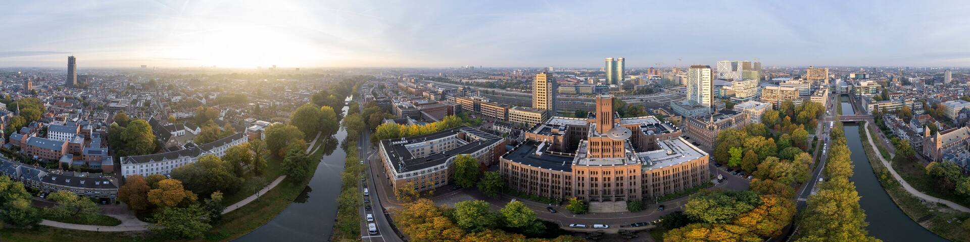 Super wide 360 degrees panoramic aerial view of the medieval Dutch centre of Utrecht with Inktpot building and cathedral towering over the city at early morning sunrise. Cityscape in The Netherlands