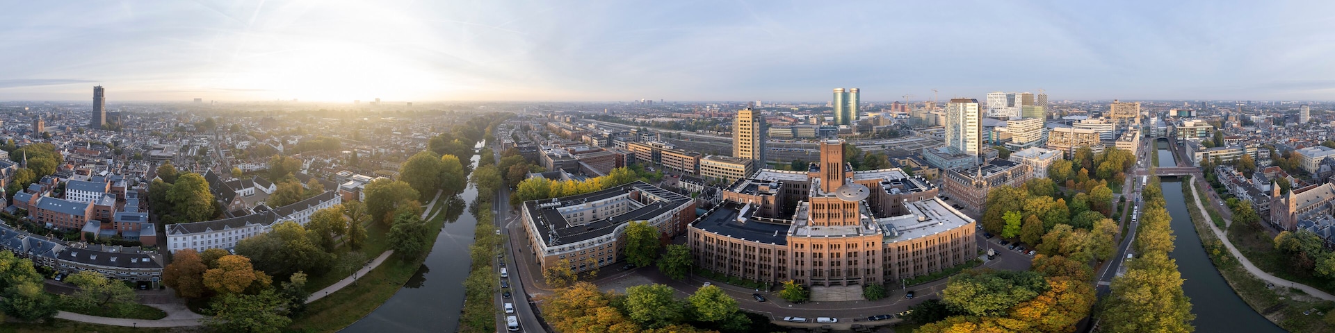 Super wide 360 degrees panoramic aerial view of the medieval Dutch centre of Utrecht with Inktpot building and cathedral towering over the city at early morning sunrise. Cityscape in The Netherlands