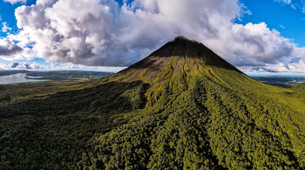 Beautiful aerial view of the Arenal Volcano, the arenal Lagoon, and rain forest in Costa Rica