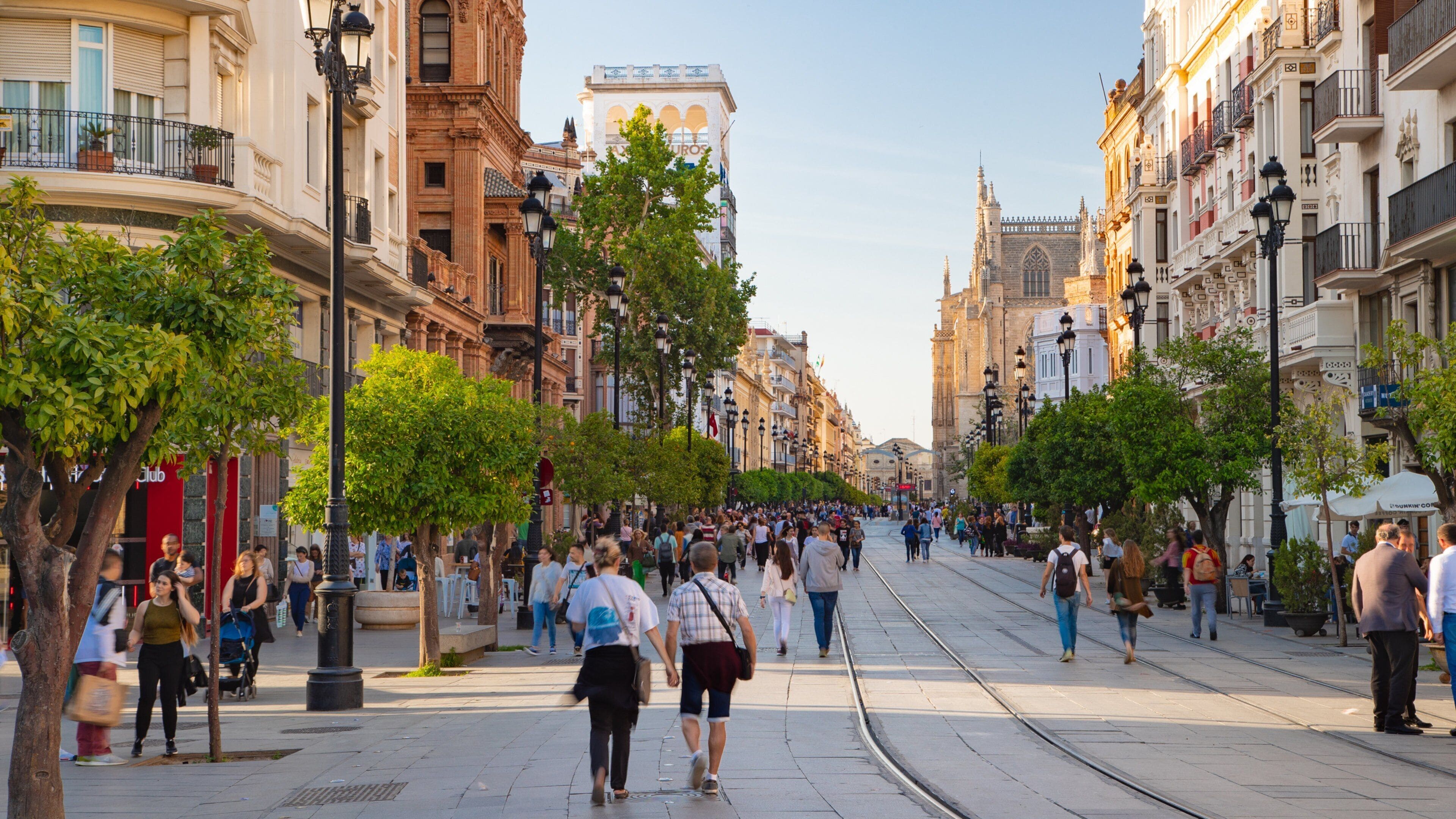 Plaza de Puerta Jerez featuring street scenes and a city as well as a large group of people