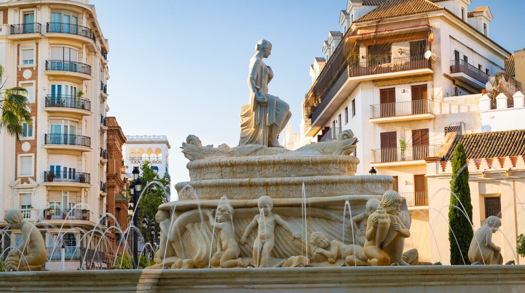 Plaza de Puerta Jerez featuring a fountain and a city