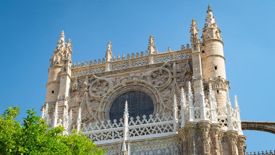 A Gothic-style cathedral with intricate stone carvings and a large circular window.