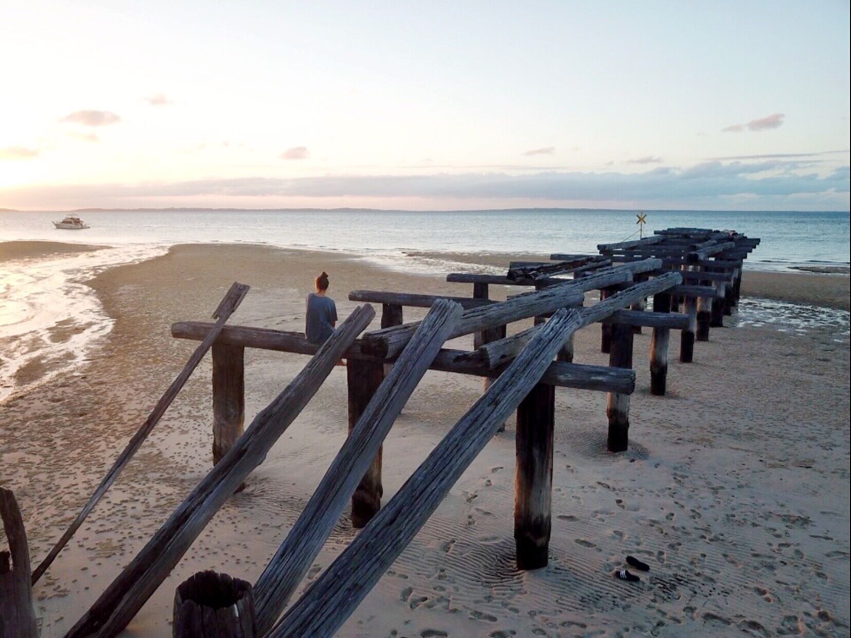 My daughter on McKenzie Pier, Fraser Island QLD AU at sunset