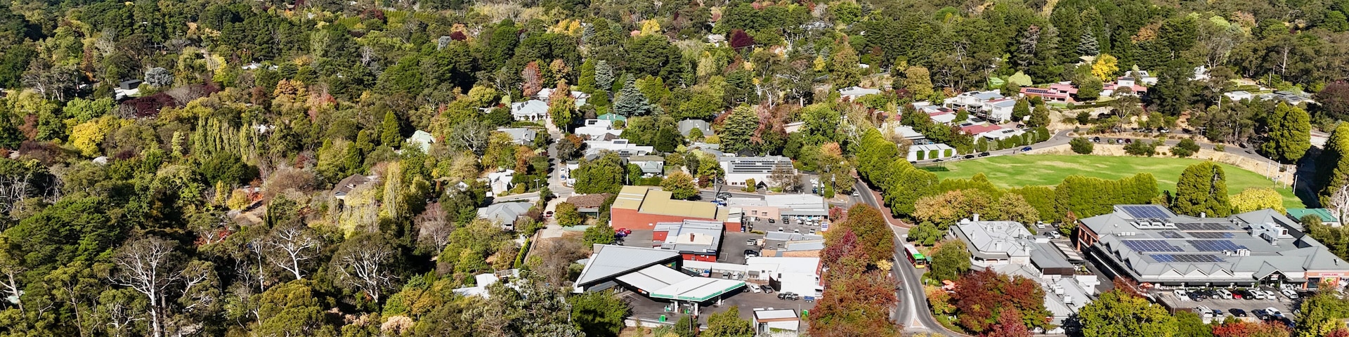 Stirling, Adelaide Hills, South Australia: Aerial Drone Image Featuring a Forested Hillside Town with Autumn Trees, Homes, Shops, Parklands, and Scenic Countryside Views of the Mount Lofty Ranges