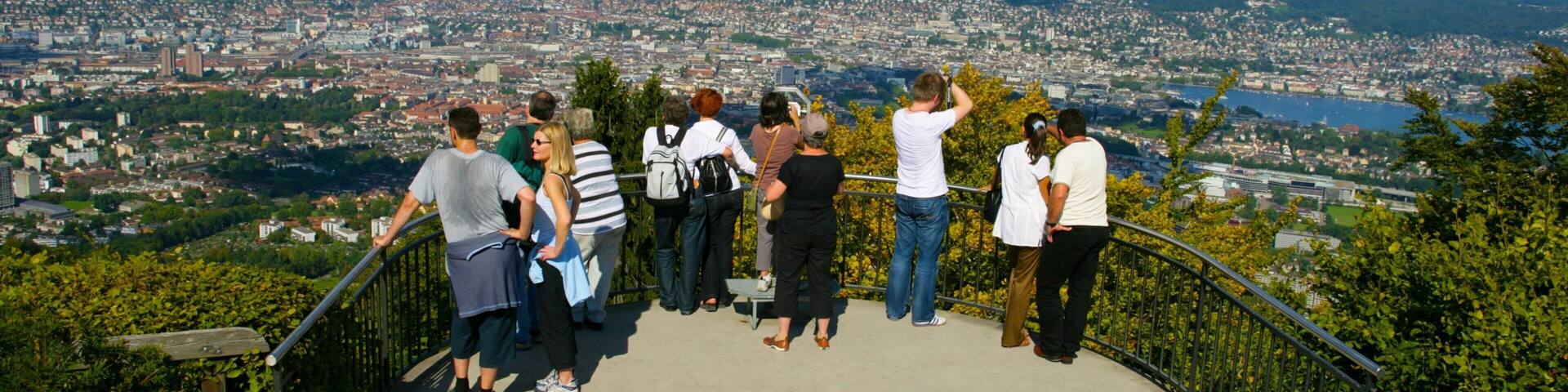 Zurich which includes a city and views as well as a large group of people