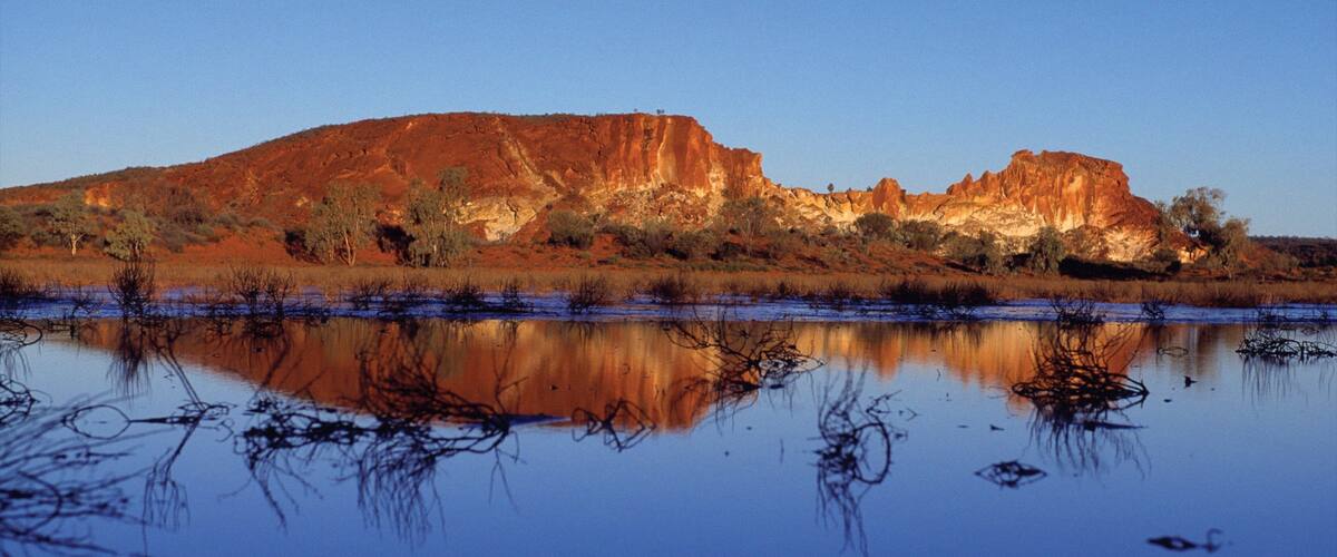 Red Centre featuring a lake or waterhole, a gorge or canyon and desert views