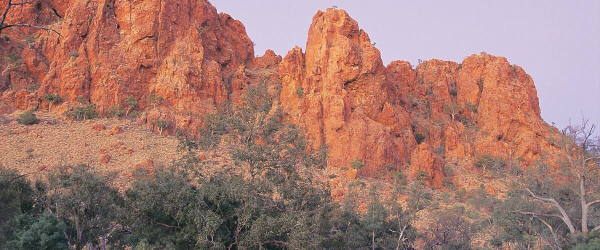 Alice Springs which includes a gorge or canyon and a sunset