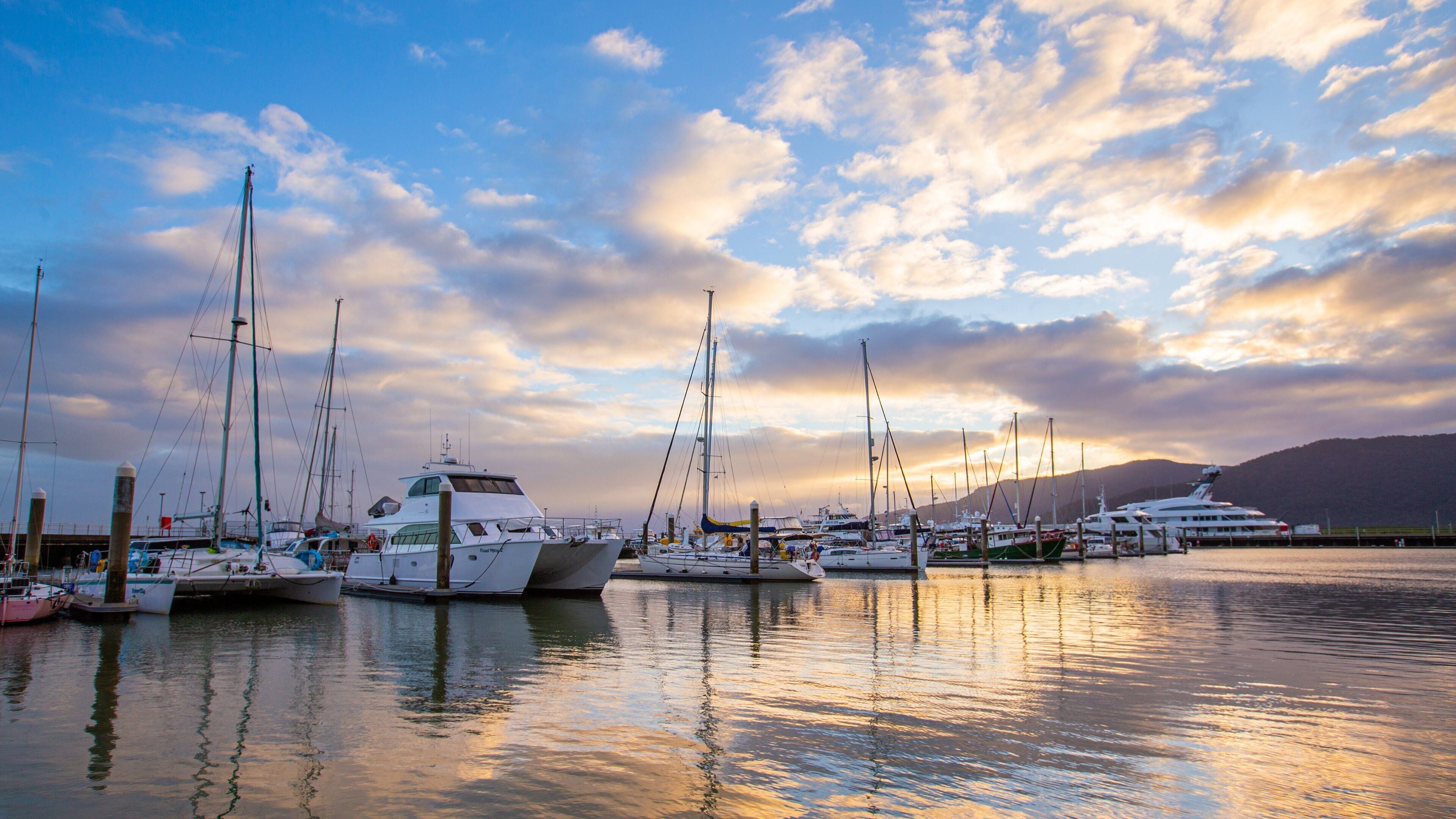 Cairns Marlin Marina showing a sunset and a bay or harbor
