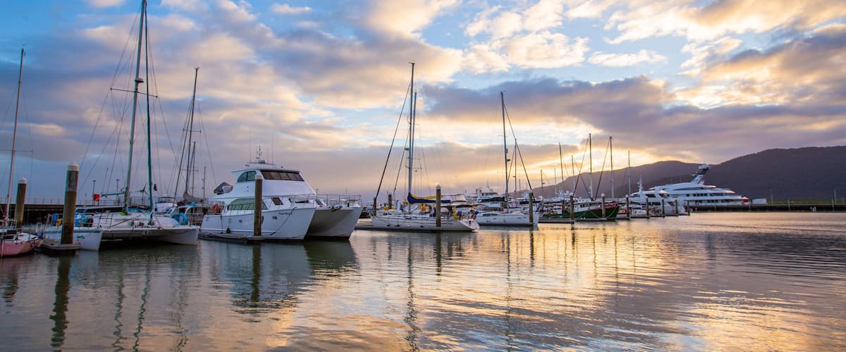 Cairns Marlin Marina showing a sunset and a bay or harbor