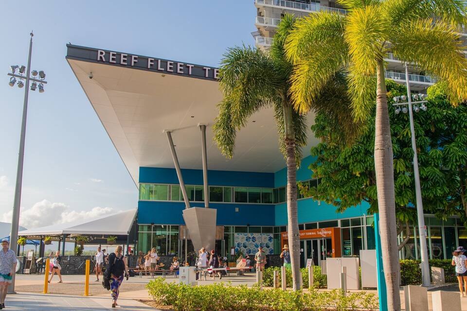 A modern building with a large sign reading "REEF FLEET Terminal."
