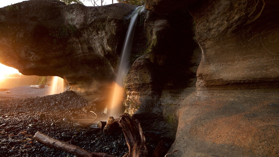 Sooke showing a pebble beach, a cascade and a sunset