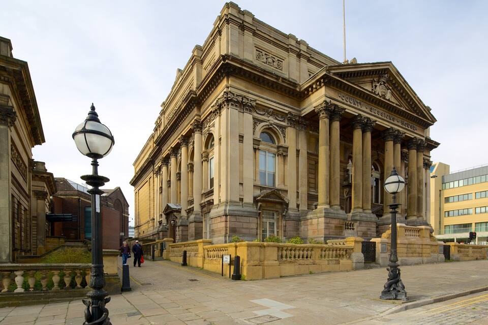 A historic building with classical architecture, including columns and detailed stonework.