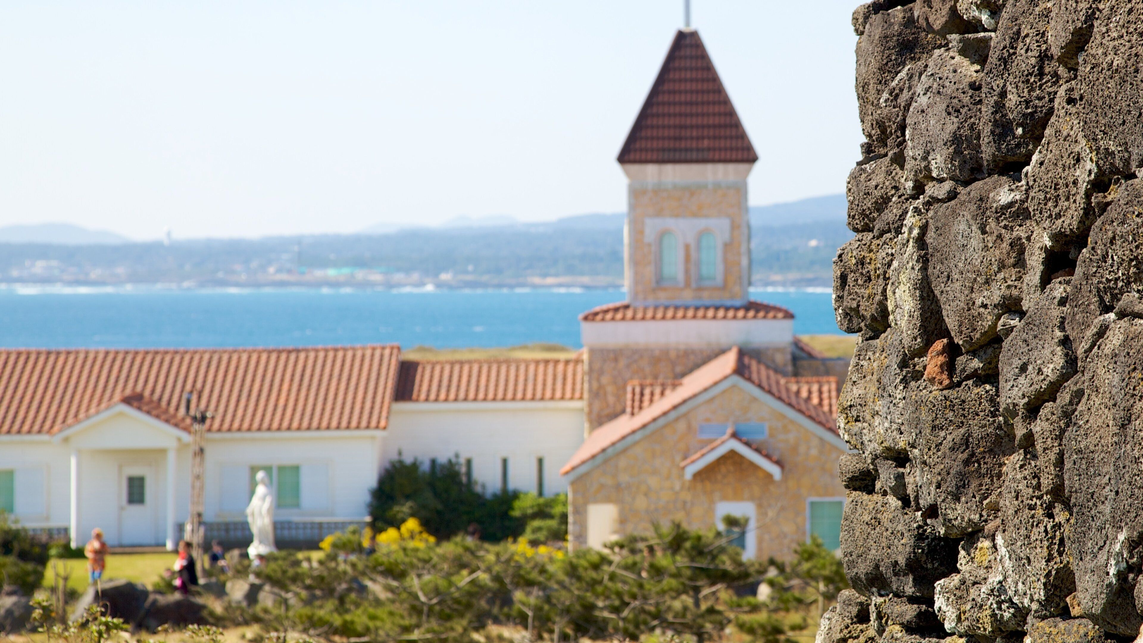 Jeju Island featuring a small town or village, a coastal town and general coastal views
