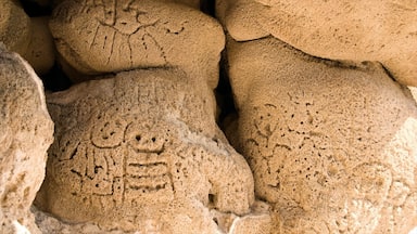 A close-up of a stone carving with intricate patterns and symbols.