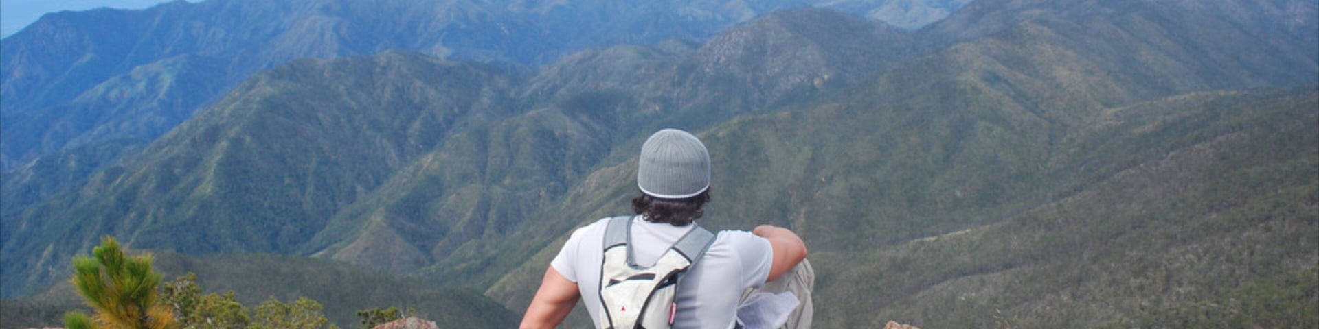 Pico Duarte featuring mountains and hiking or walking as well as an individual male