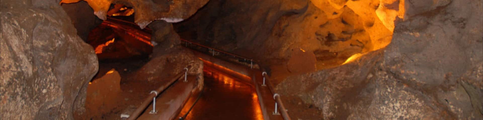 Cueva de las Maravillas National Park featuring interior views and caves