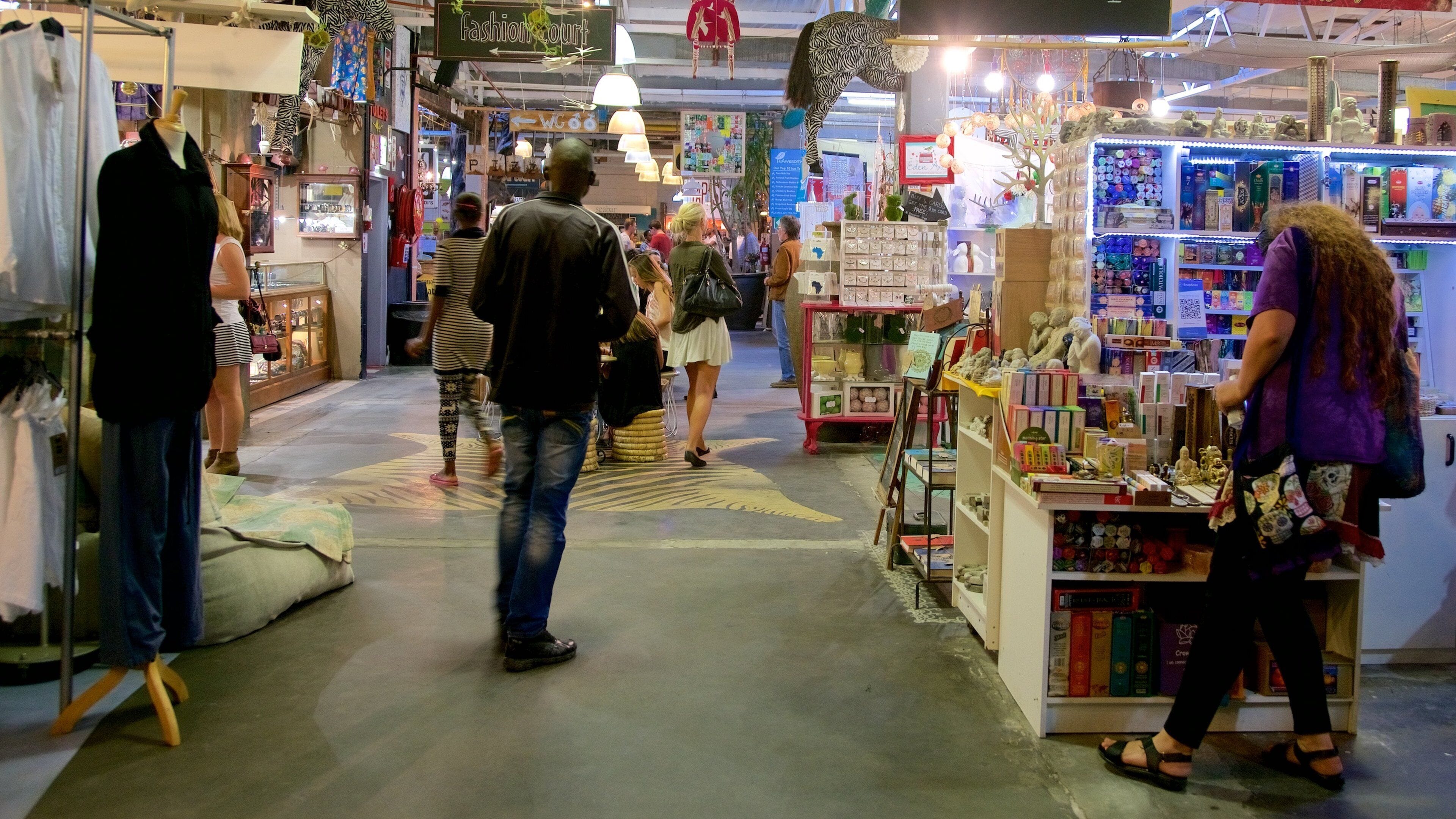 Hout Bay Craft Market showing markets and interior views as well as a large group of people