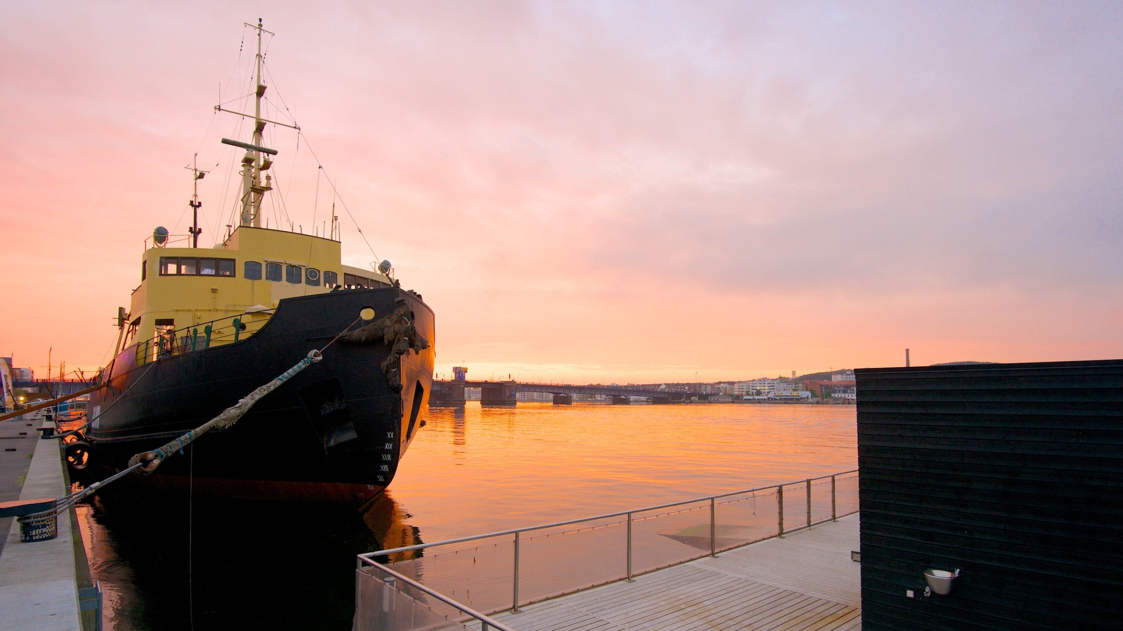 Aalborg which includes a marina, a sunset and boating