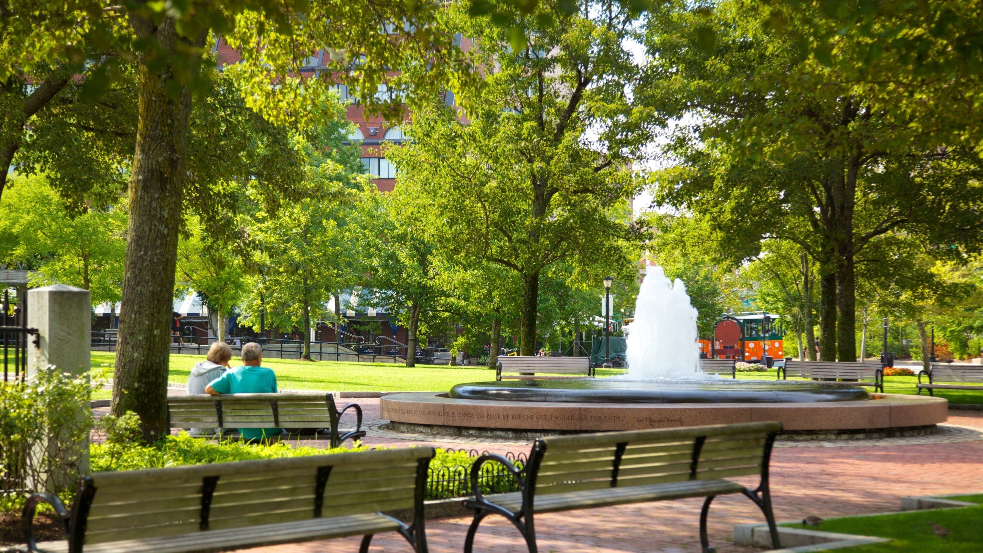 Boston Harbor which includes a park and a fountain as well as a couple