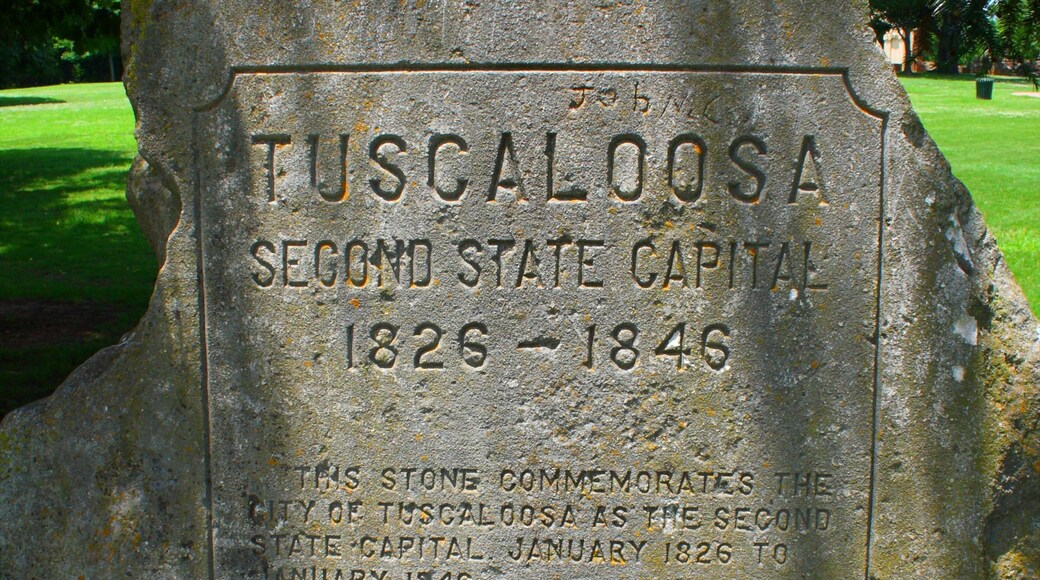 Capitol Park showing a garden, a memorial and signage