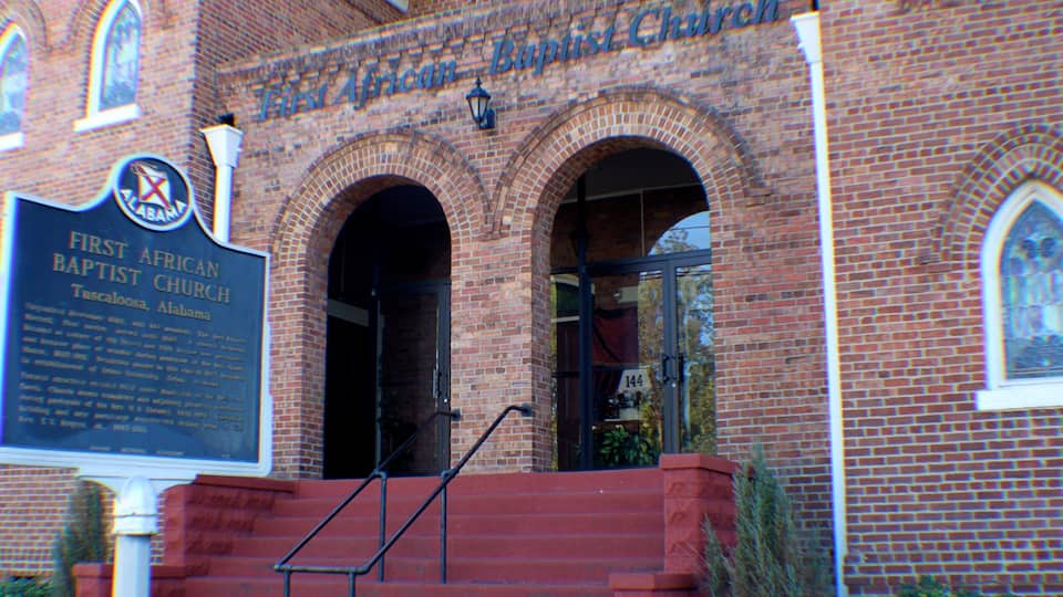 Tuscaloosa showing a church or cathedral and signage