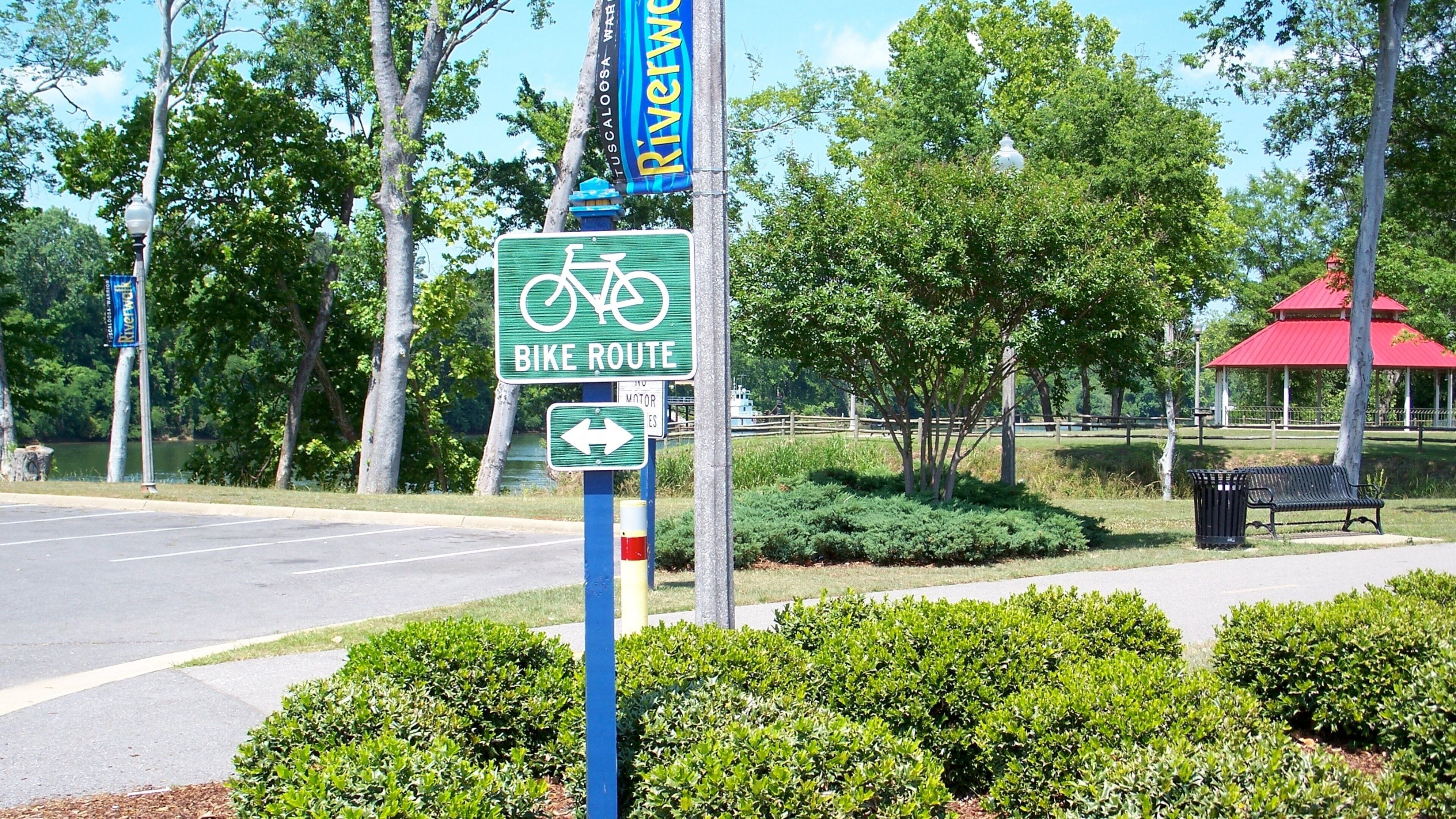 Tuscaloosa River Walk featuring signage and a park