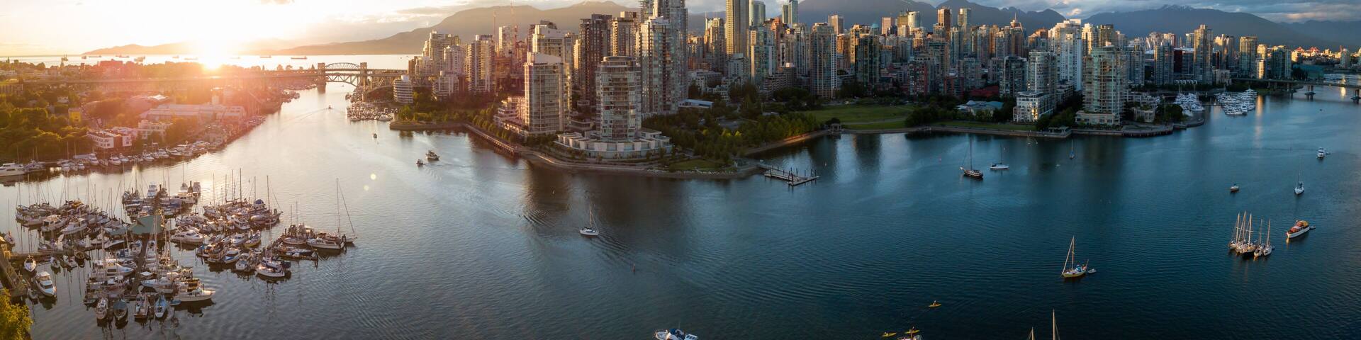 Aerial Panorama of Downtown City at False Creek, Vancouver, British Columbia, Canada. Taken during a bright sunset.