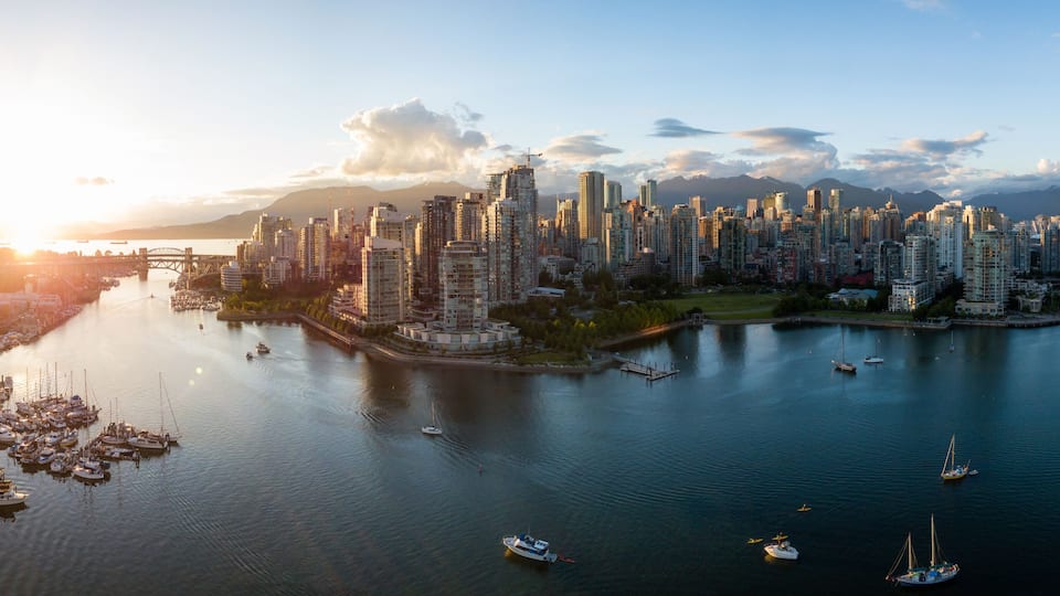 Aerial Panorama of Downtown City at False Creek, Vancouver, British Columbia, Canada. Taken during a bright sunset.