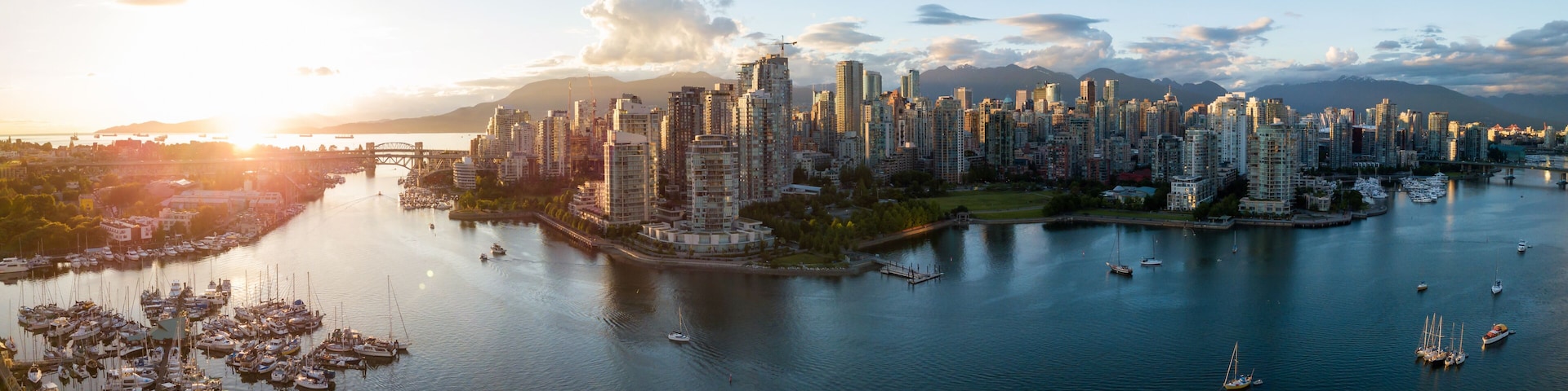 Aerial Panorama of Downtown City at False Creek, Vancouver, British Columbia, Canada. Taken during a bright sunset.