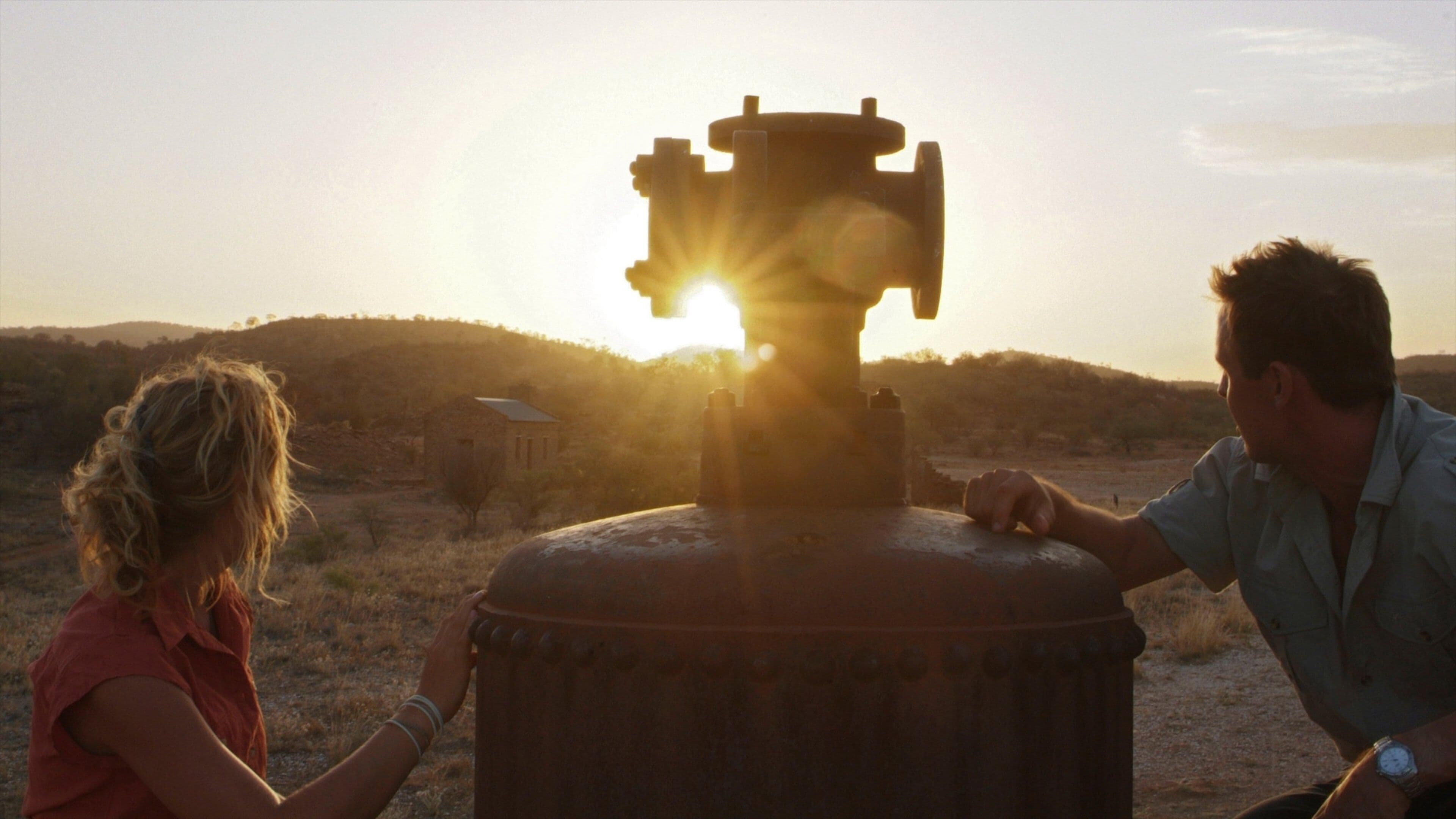 Alice Springs showing tranquil scenes and a sunset as well as a couple