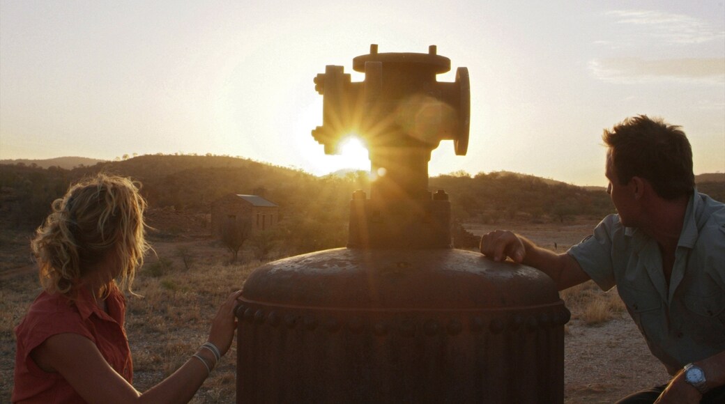 Alice Springs showing tranquil scenes and a sunset as well as a couple