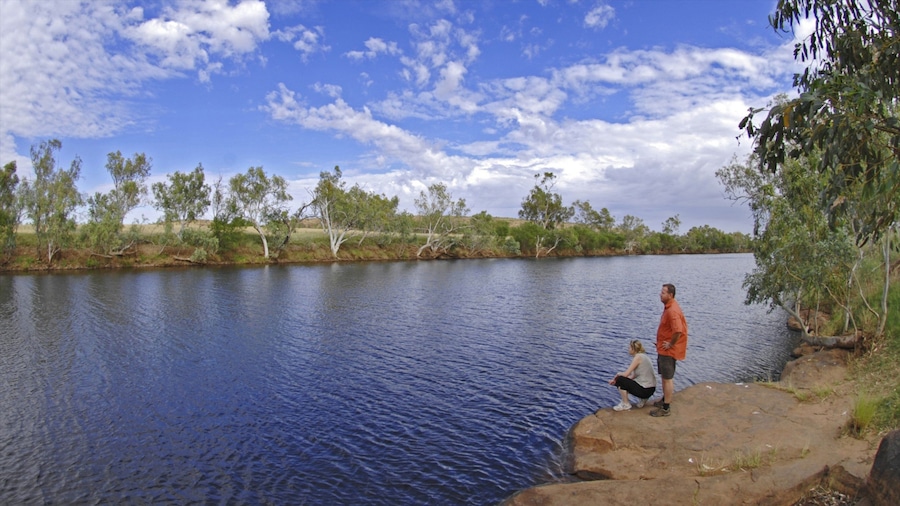 Red Centre which includes hiking or walking and a river or creek as well as a couple