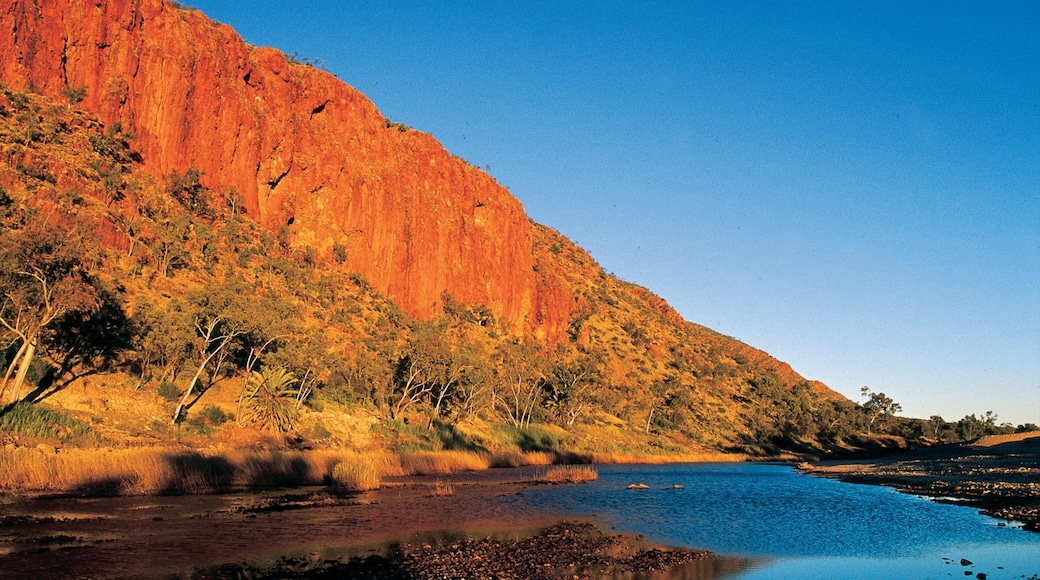 Glen Helen Gorge which includes a gorge or canyon, a sunset and a river or creek