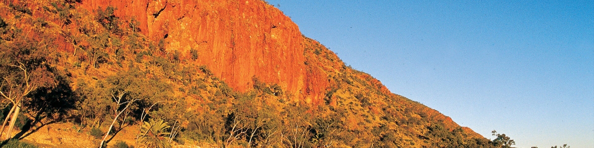 Glen Helen Gorge which includes a gorge or canyon, a sunset and a river or creek