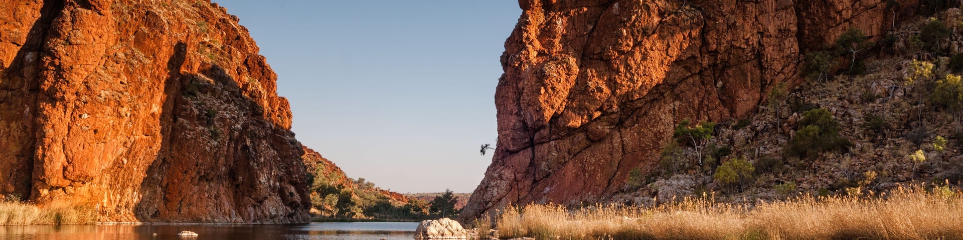 Reflections of rock formations at Glen Helen Gorge water hole