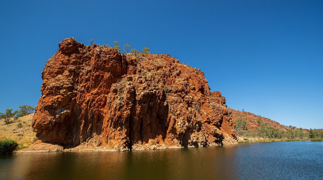 Glen Helen Gorge which includes a lake or waterhole and a gorge or canyon