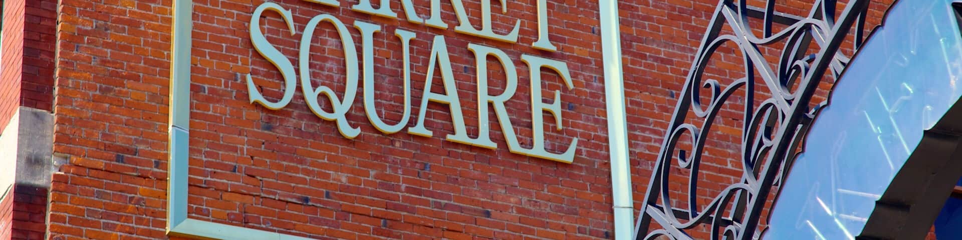 A brick wall with a large sign that reads "MARKET SQUARE".