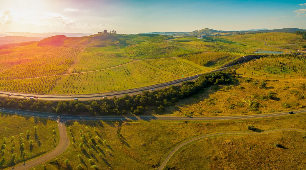 Aerial panorama of Tuggeranong Parkway and National Arboretum at sunset in Canberra, Australia
