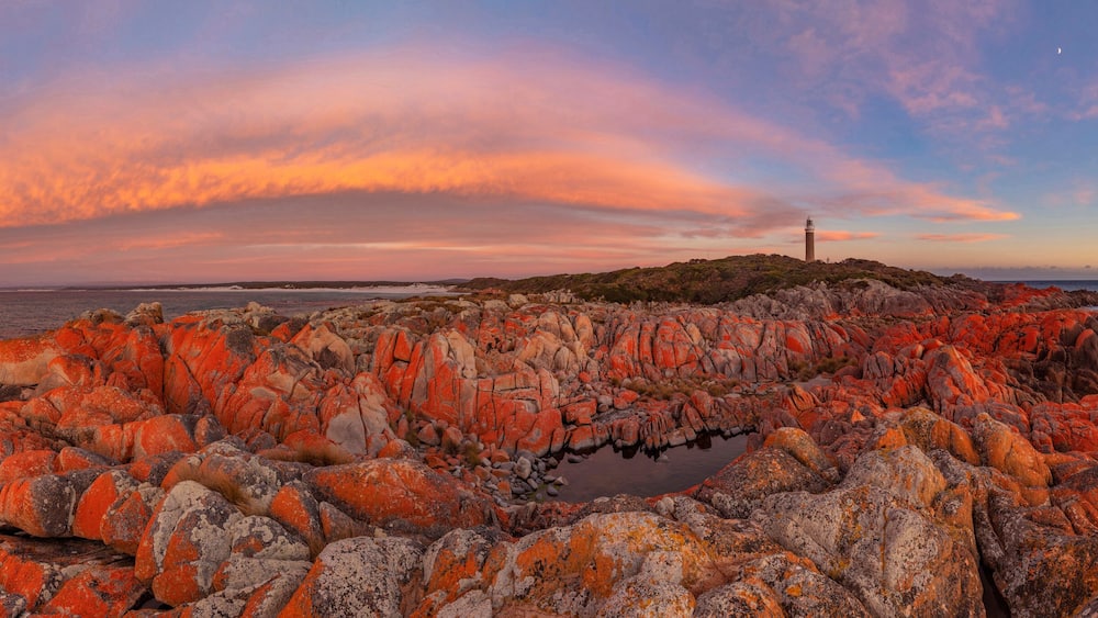 Beautiful sunrise over the magnificent, Eddystone Point Lighthouse. Situated within Mount William National Park. Part of the Bay of Fires Conservation Area. North Eastern Tasmania, Australia.