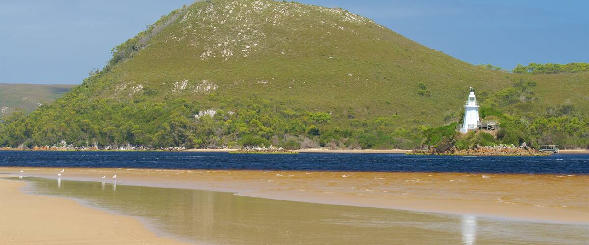 Macquarie Heads featuring a beach, a lighthouse and a river or creek