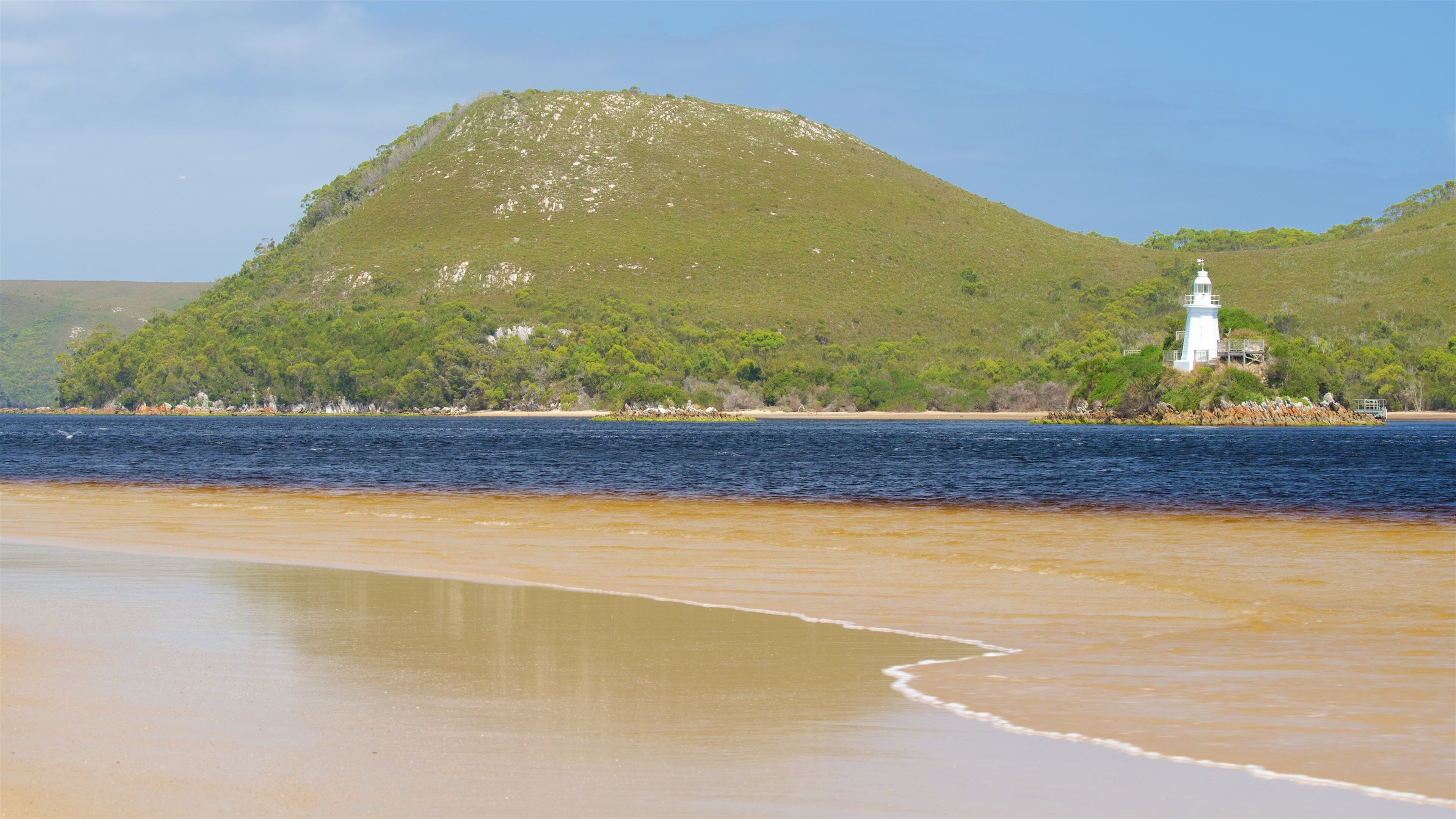 Macquarie Heads featuring a sandy beach, a lighthouse and a river or creek